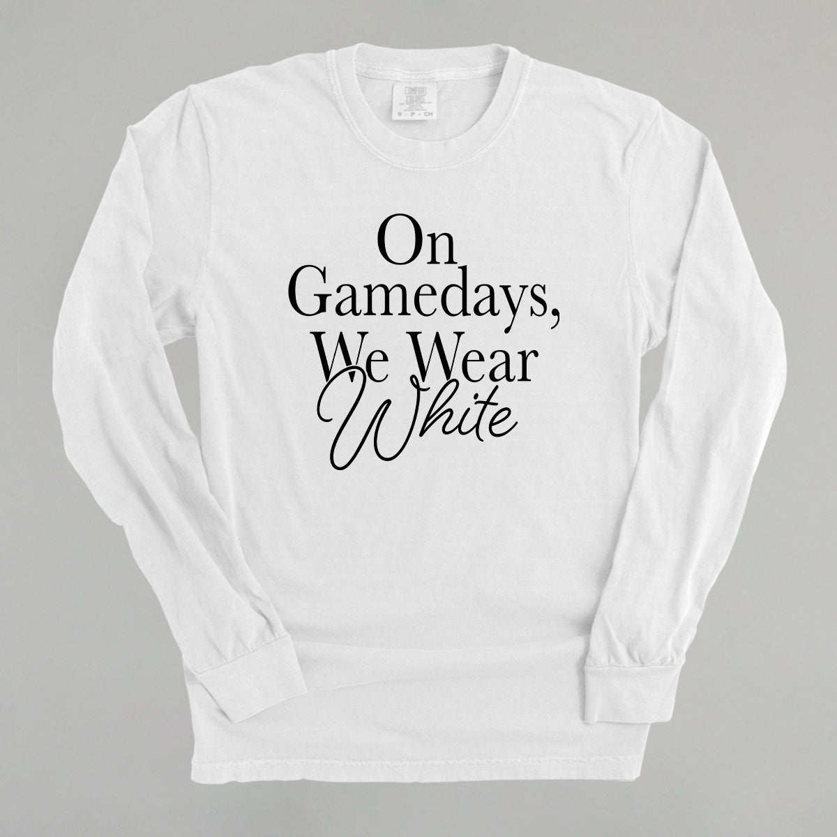 Long sleeve white tee with 'On Game Days, We Wear White' design for game day white apparel.